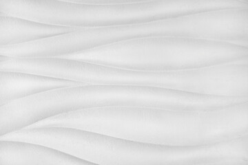 Obraz premium Plaster wall with volumetric relief surface wavy form pattern, white gypsum texture panel.