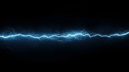 A bolt of lightning flashes across a black backdrop, lighting up the sky with its electric blue power.