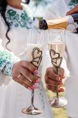 Elegant Celebration with Toasting Champagne Flutes Adorned with Heart Details