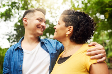 Fototapeta premium Park, couple and admiration with hug for connection, happy marriage and relationship in backyard. People, woman and man with love embrace for bonding together, commitment and outdoor for affection