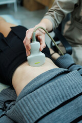 Examination using an ultrasound machine at work. Modern clinical diagnosis and treatment....