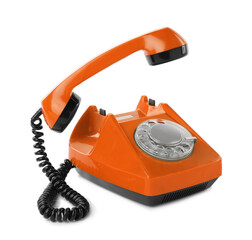 Old orange telephone with rotary dial isolated on white