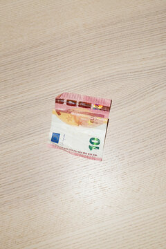 Close-up View of 10 Euro Note on Wooden Surface