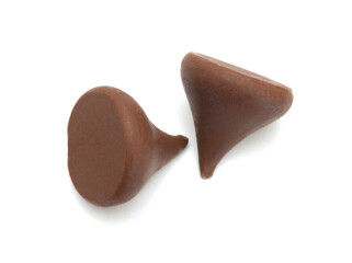 Close up pile of chocolate morsels on white background