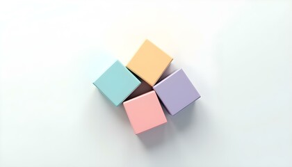 Obraz premium Four pastel boxes are neatly arranged on a white background, creating an appealing minimalist look