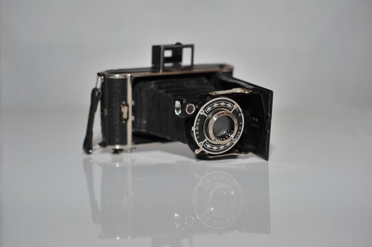 Old vintage foto camera isolated on white background - Powered by Adobe