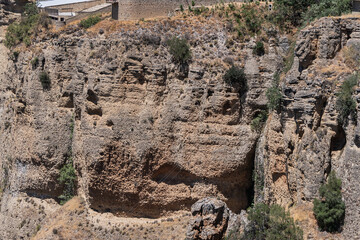 The rocky, sheer-sided limestone cliffs of Ronda Gorge (El Tajo de Ronda) plummet 390 feet (120...