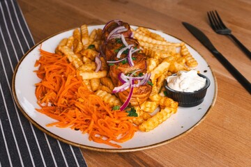 Traditional Polish food. Shish kebab, french fries and carrots with garlic sauce 