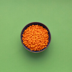 Organic red lentils in the bowl - Lens culinaris.