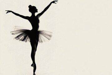 Silhouette of a young ballerina dancing gracefully in tutu dress