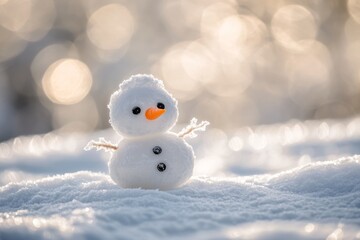 Small snowman standing on a snowy surface with bokeh background