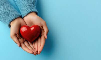 Fototapeta premium Hands Offering a Red Heart: Symbolizing Healthcare and Global Support