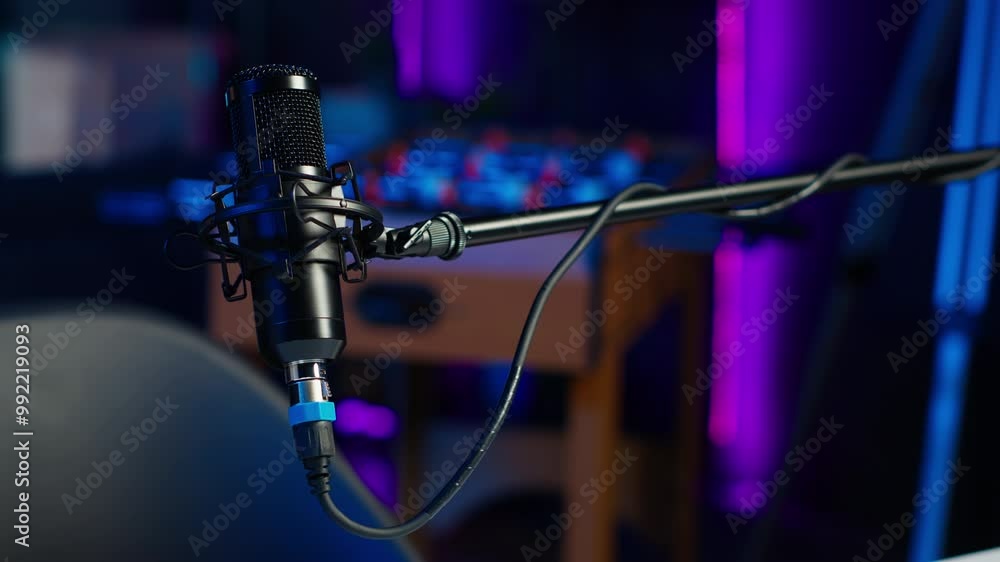 Poster close up shot of professional microphone in empty studio illuminated with rgb lights at night, used 