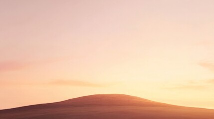 A breathtaking autumn sunset over a hill, showcasing warm tones blending seamlessly in the sky. The vibrant colors of orange, gold, and deep red create a stunning backdrop