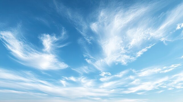 A tranquil scene with cirrus clouds, wispy and thin, high in the sky on a clear day, symbolizing fair weather.