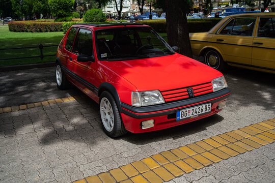 Red Peugeot 205 1.9 GTI is parked in Subotica, Srebia 09.06.2024