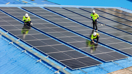 engineer man inspects construction of solar cell panel or photovoltaic cell by electronic device....