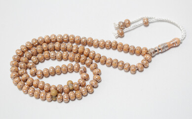 Cream colored prayer beads isolated on white background