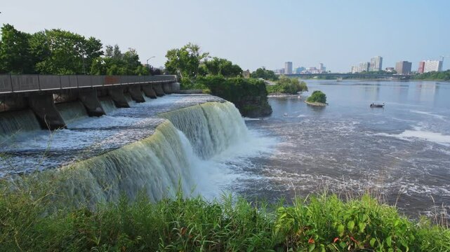 Rideau Falls on a warm summer morning flowing into the Ottawa River