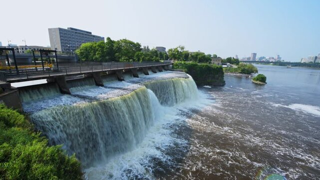 Rideau Falls on a warm summer morning flowing into the Ottawa River