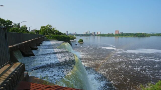 Rideau Falls on a warm summer morning flowing into the Ottawa River