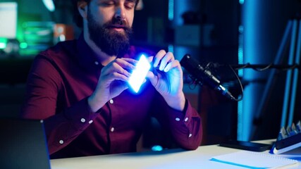 Reviewer discussing with viewers about mini led lights during live broadcast on internet, close up. Influencer chatting with fans during stream, filming RGB lighting device in studio, camera A