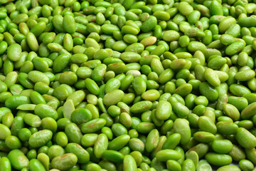 Fresh edamame beans as background, closeup view