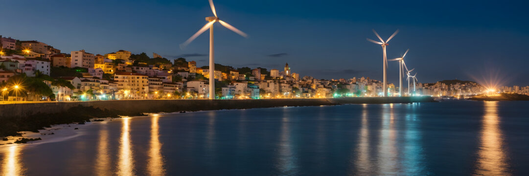 Eolic  Wind Turbines Energy Supplies Electricity to a City at Nigh. Distribution of Clean and Sustainable Energy Power