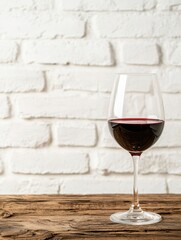 glass of red wine on rustic wooden table
