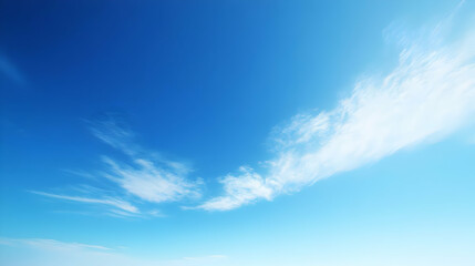 Fototapeta premium Beautiful Blue Sky with White Clouds Streaks, a Natural Background for Digital Art or Design