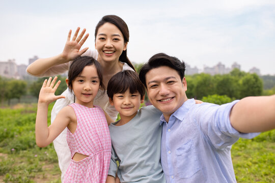 Family Having Fun In A Park
