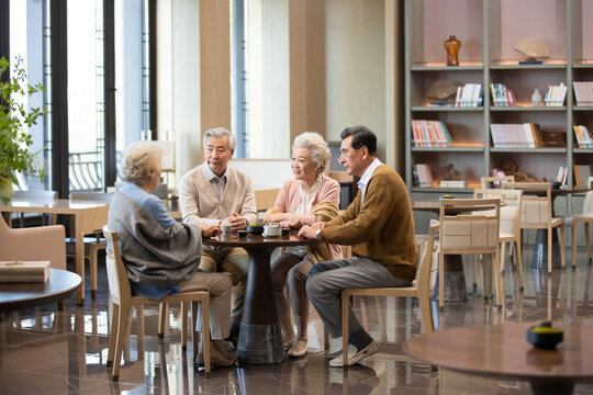 Happy Senior Adults in a Book Cafe