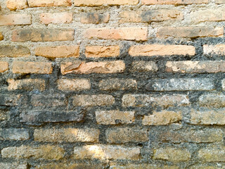 an old wall made of bricks that is worn and mossed, for the background