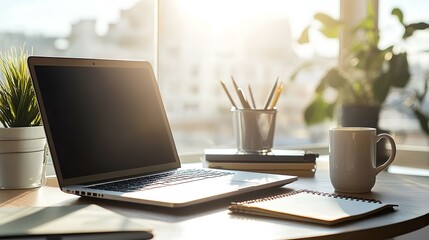 Fototapeta premium Bright Workspace with Open Laptop and Coffee Mug
