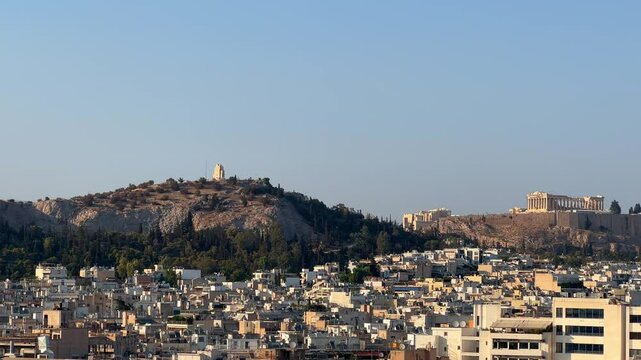 Lofos Philapappou and Acropolis in Athens seen in the distance, summer time