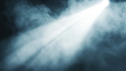 Fototapeta premium Bright Spotlight Filtering Through Thick Smoke