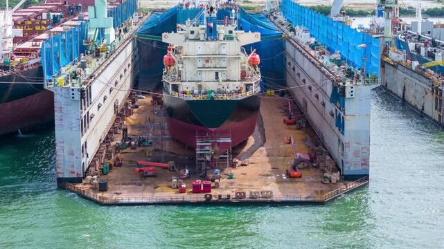 Time lapse cargo container ship at dry dock concept maintenance service working in the sea. Insurance and Maintenance Cargo Ship concept. Freight Forwarding Service maintenance Insurance	
