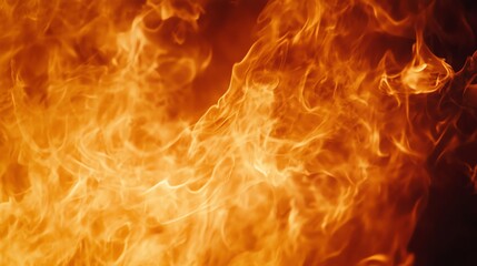 Fototapeta premium Intense flames dance in vivid orange and yellow hues, creating a mesmerizing display of heat and energy.