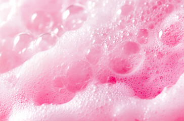 Fototapeta premium Close-up of pink sponge texture background with bubbles