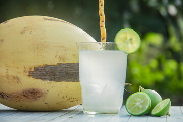 Fresh coconut water from yellow coconuts added with lime juice