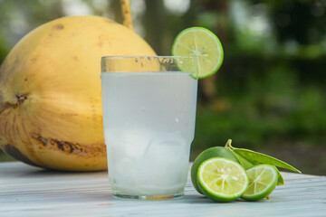 Fresh coconut water from yellow coconuts added with lime juice