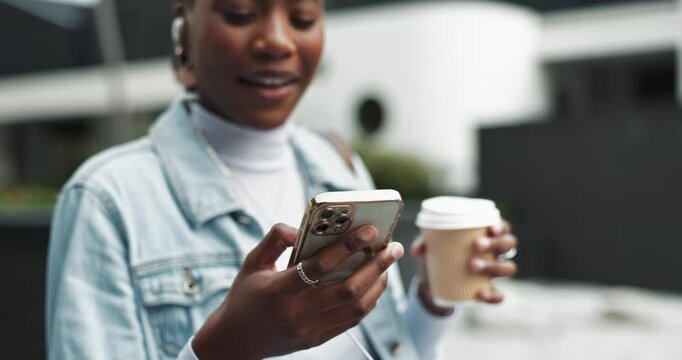 Hands, phone and black woman smile in city with earphones for streaming comic video, social media and conversation. Happy, female person and mobile with coffee for reading blog, music or urban travel