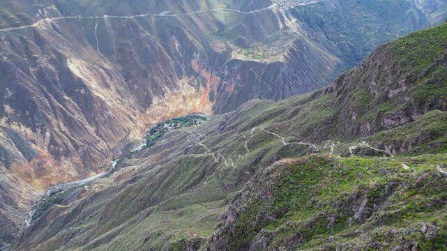 Aerial view far down into deep river valley to Sangalle Oasis in Peru