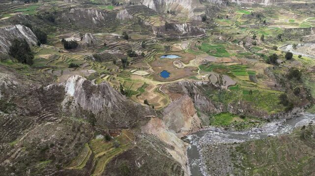 Flyover Rio Colca and terraced agriculture fields in rugged south Peru