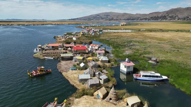 Flyover unique off-grid floating Uros Islands in Lake Titicaca, Peru