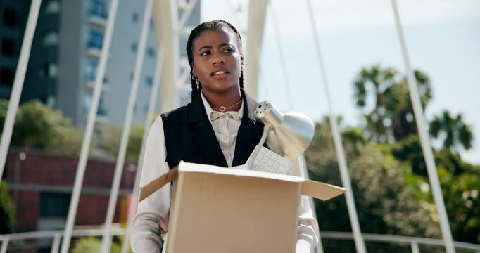 Business woman, fired and box in city with documents, frustrated and unemployed on walk in street. African person, worry and stress with cardboard, package and sad with paperwork on bridge in Kenya
