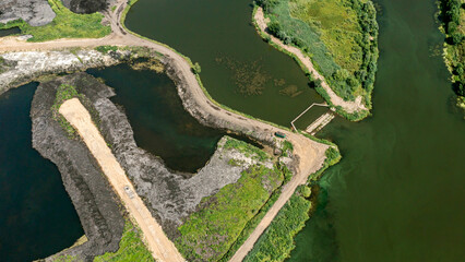 drainage of swampy area. meliorative works. land improvement and reclamation. aerial overhead view.