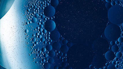 Blue oil bubbles in water