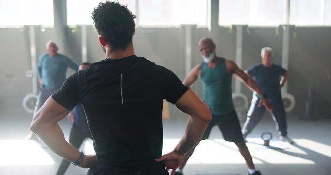 Stretching, gym and coach with senior people for training, exercise or warm up for workout. Sports, pilates and personal trainer with mature men and women for wellness, health or fitness for mobility