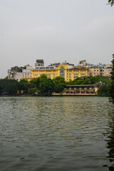 Fototapeta premium Hanoi Vietnam, yellow buildings at the Hoan Kiem Lake in Hanoi city outdoor at daytime.